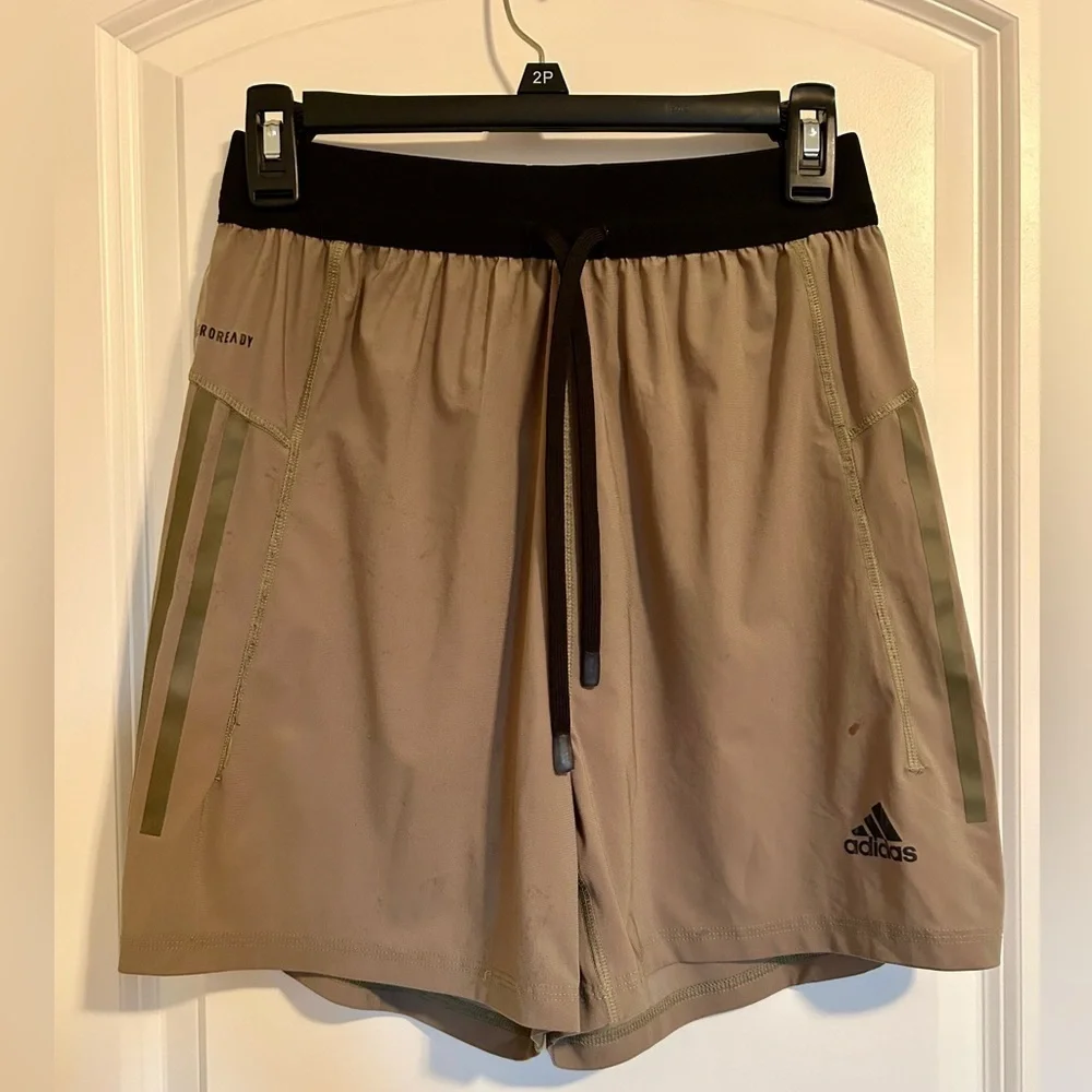 Men’s beige and black striped Adidas athletic shorts
